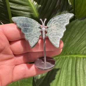 Mosagat sommerfugl st�ende p� fod