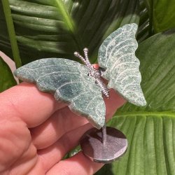 Mosagat sommerfugl st�ende p� fod