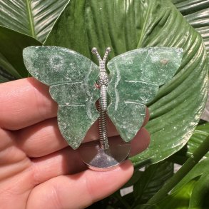 Fluorit sommerfugl st�ende p� fod