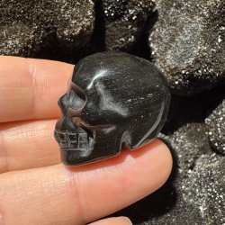 Guld obsidian skull