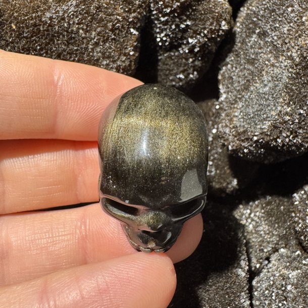 Guld obsidian skull