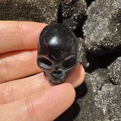 Guld obsidian skull