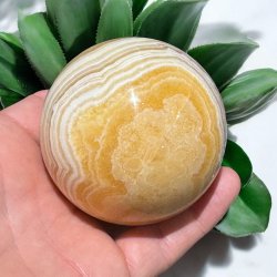 Orange stribet calcit kugle 69mm