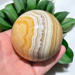 Orange stribet calcit kugle 69mm