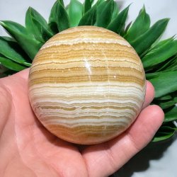 Orange stribet calcit kugle 69mm