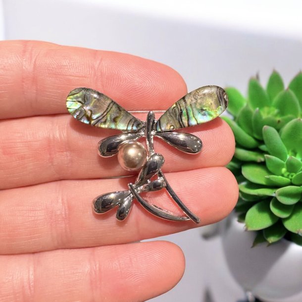 Guldsmed broche med pauaskal