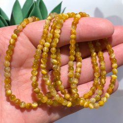 Gylden tiger�je armb�nd 4mm